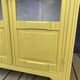 Antique yellow display cabinet