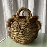Handwoven vintage basket with handles made from natural fibres.