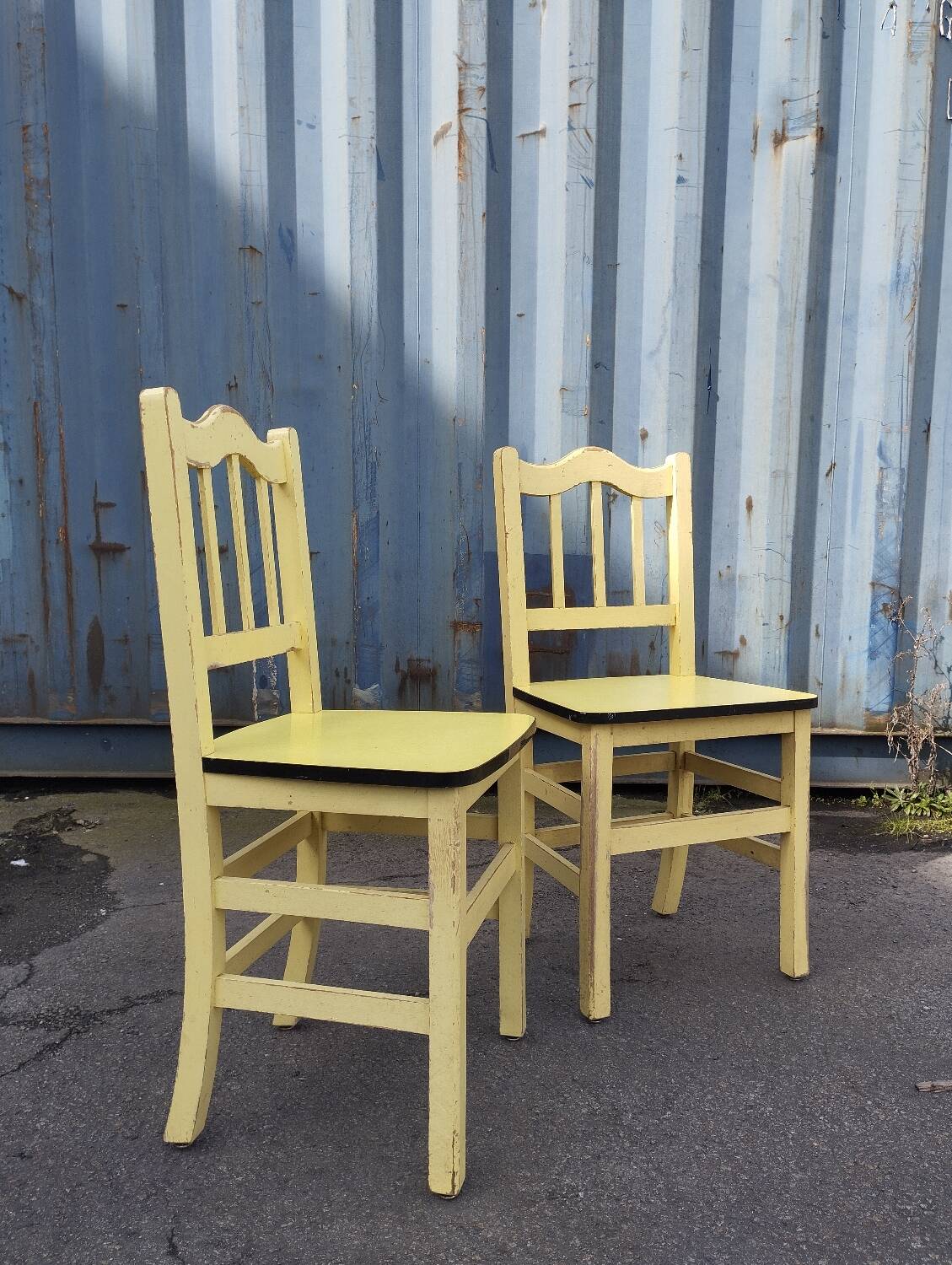 Pair of wooden and yellow formica chairs