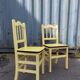 Pair of wooden and yellow formica chairs