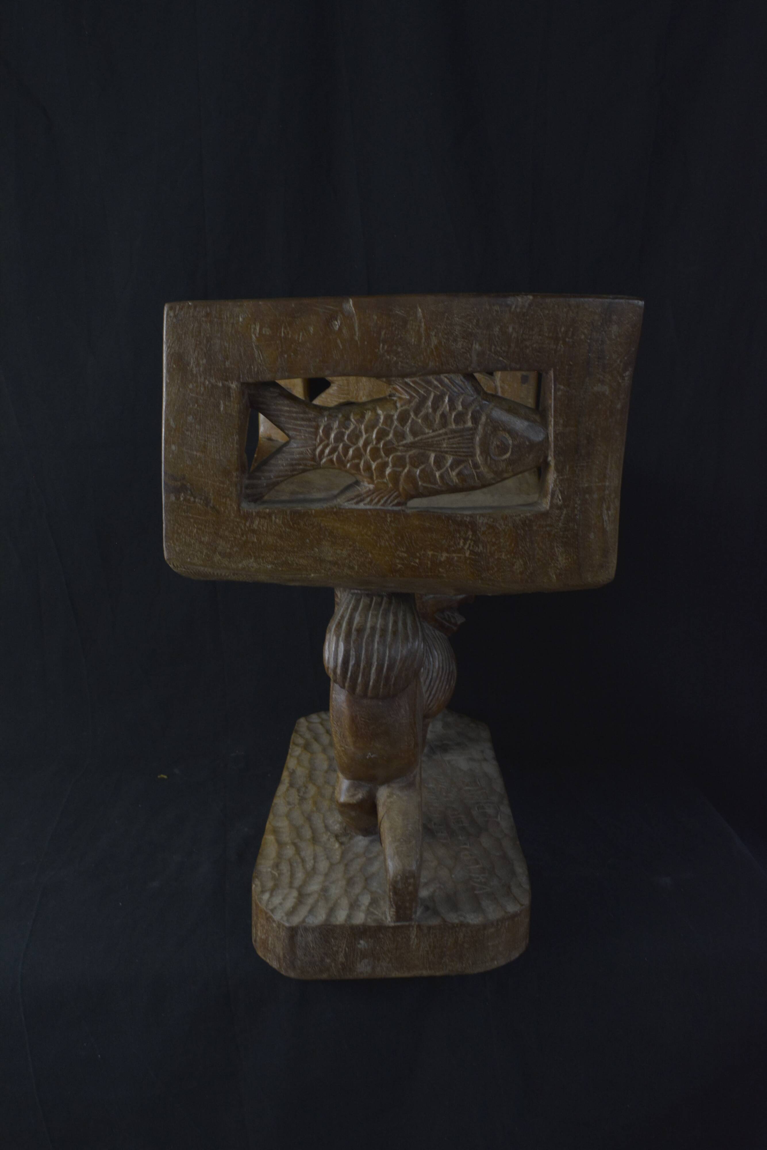 Togolese ethnic stool in carved exotic wood.