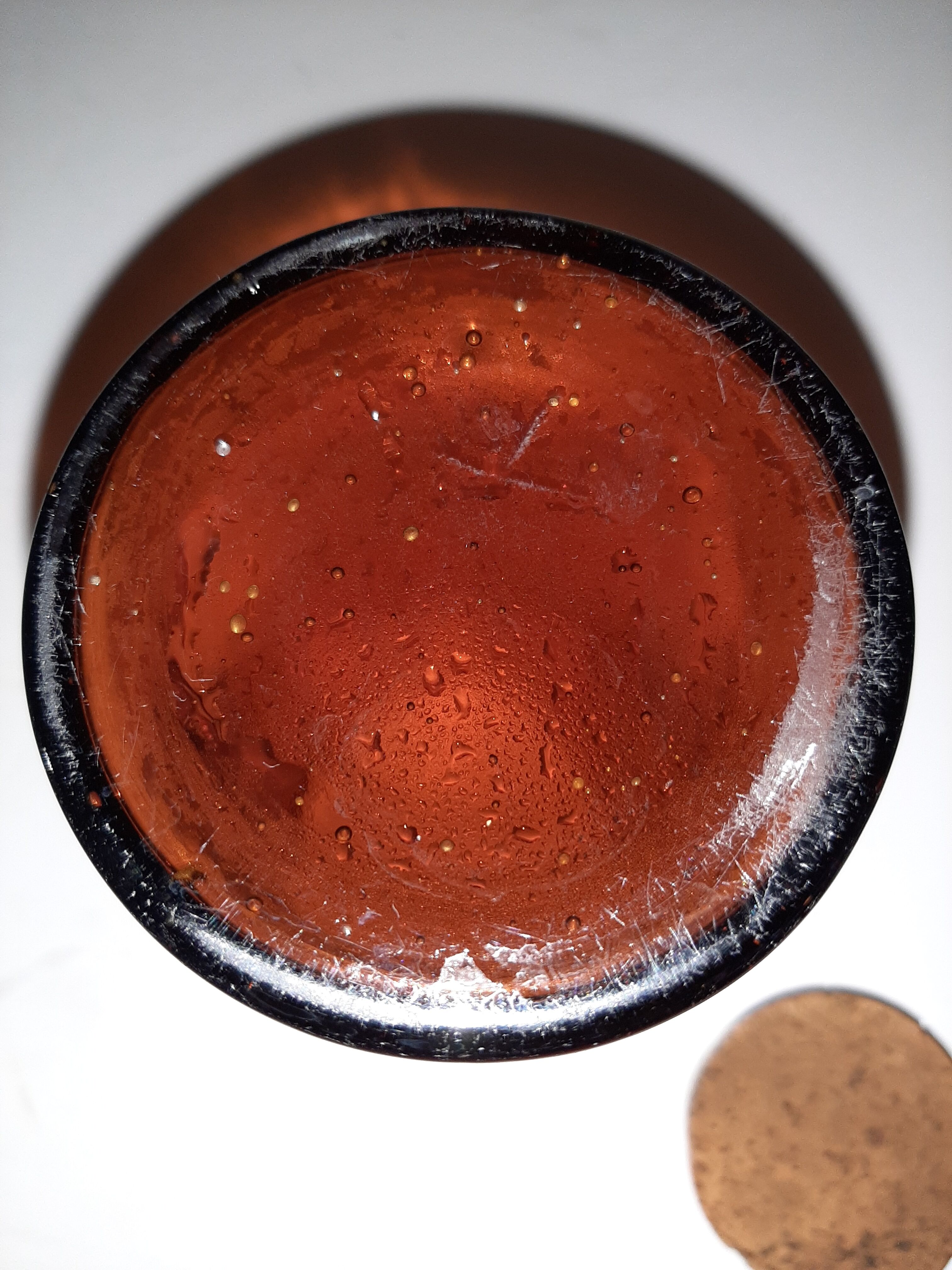 Amber pharmacy bottle made of old bubbled glass