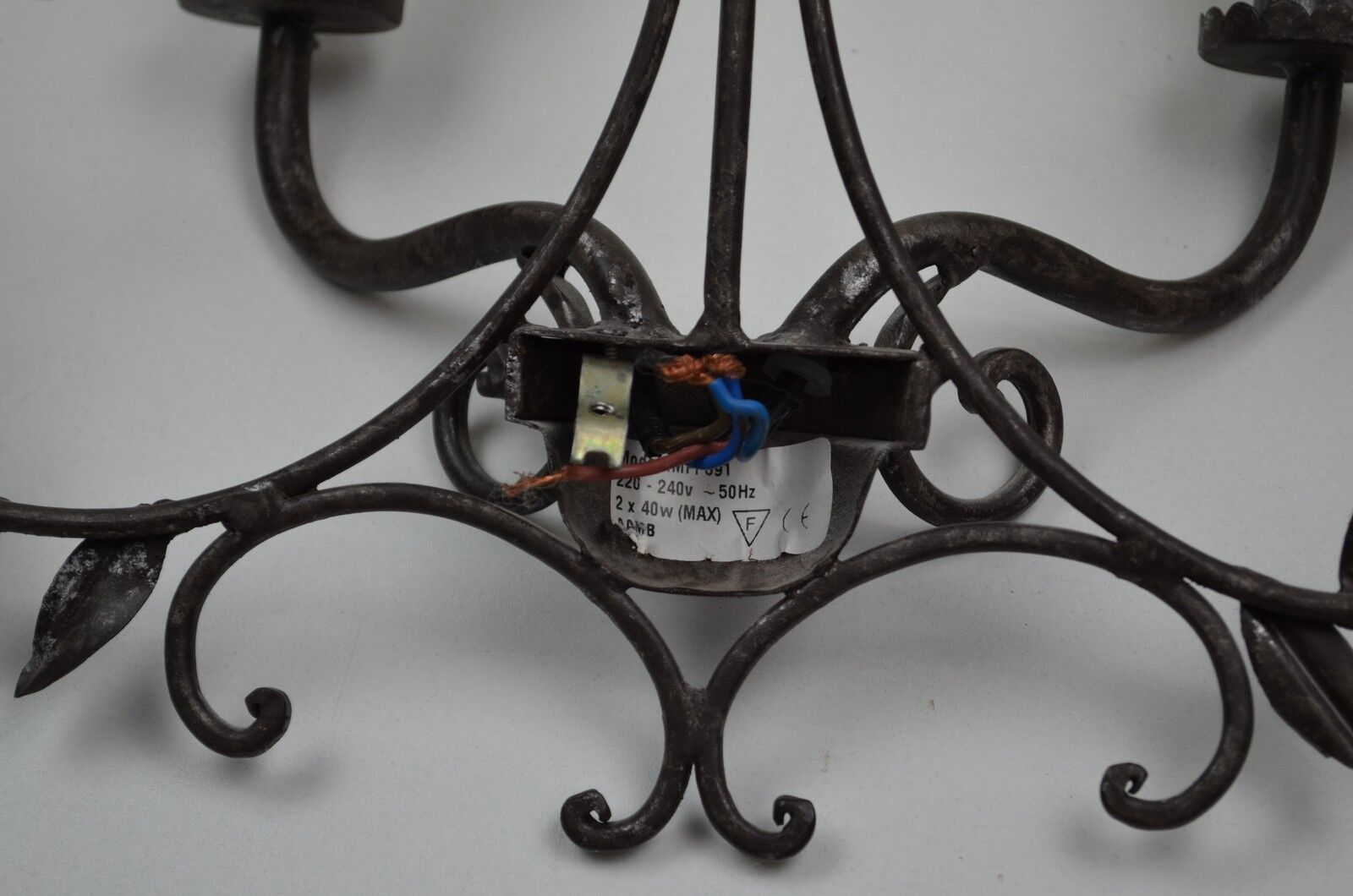 pair of grey patinated iron wall sconces