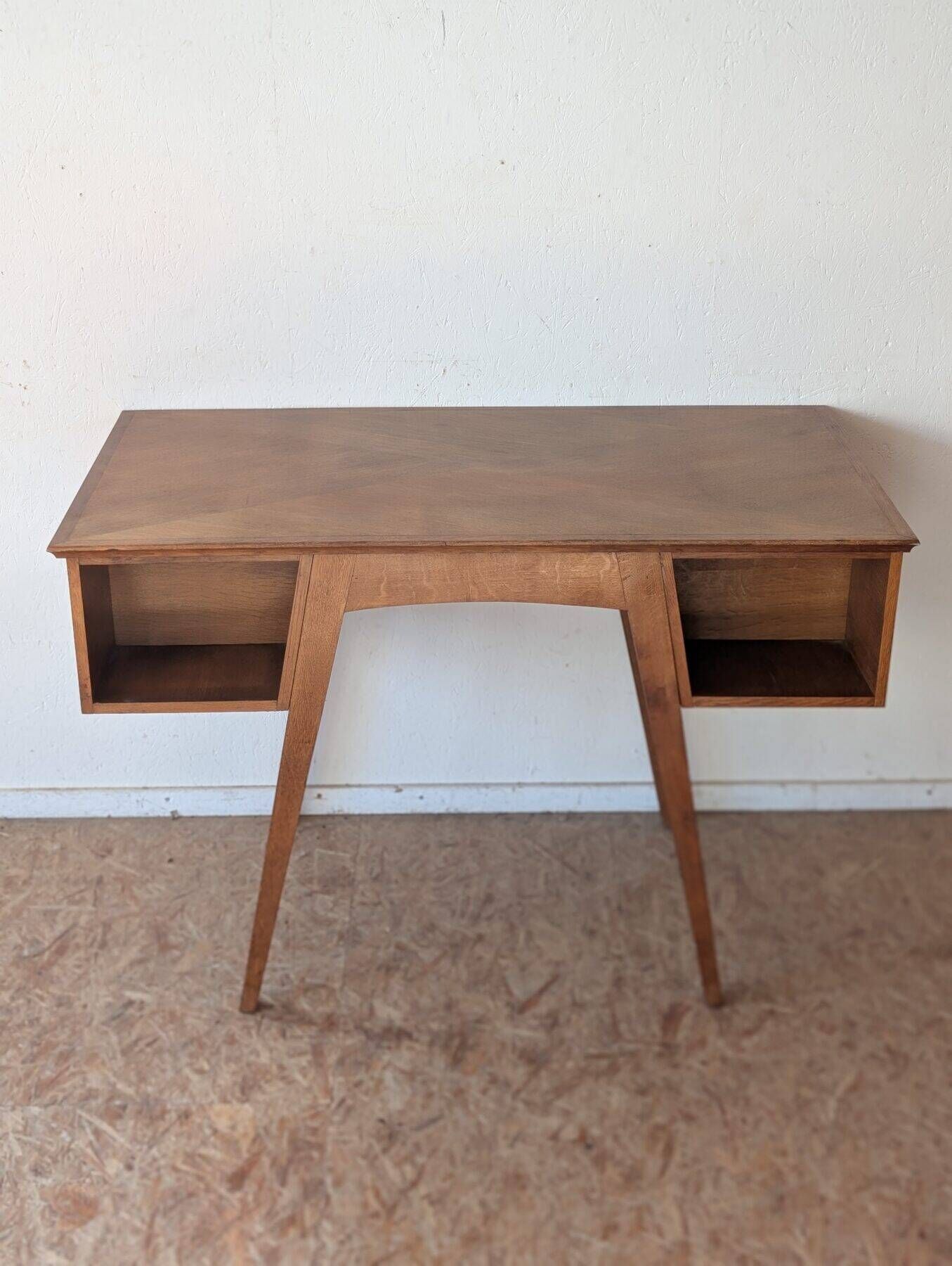 1950s oak double-sided desk with compass legs.