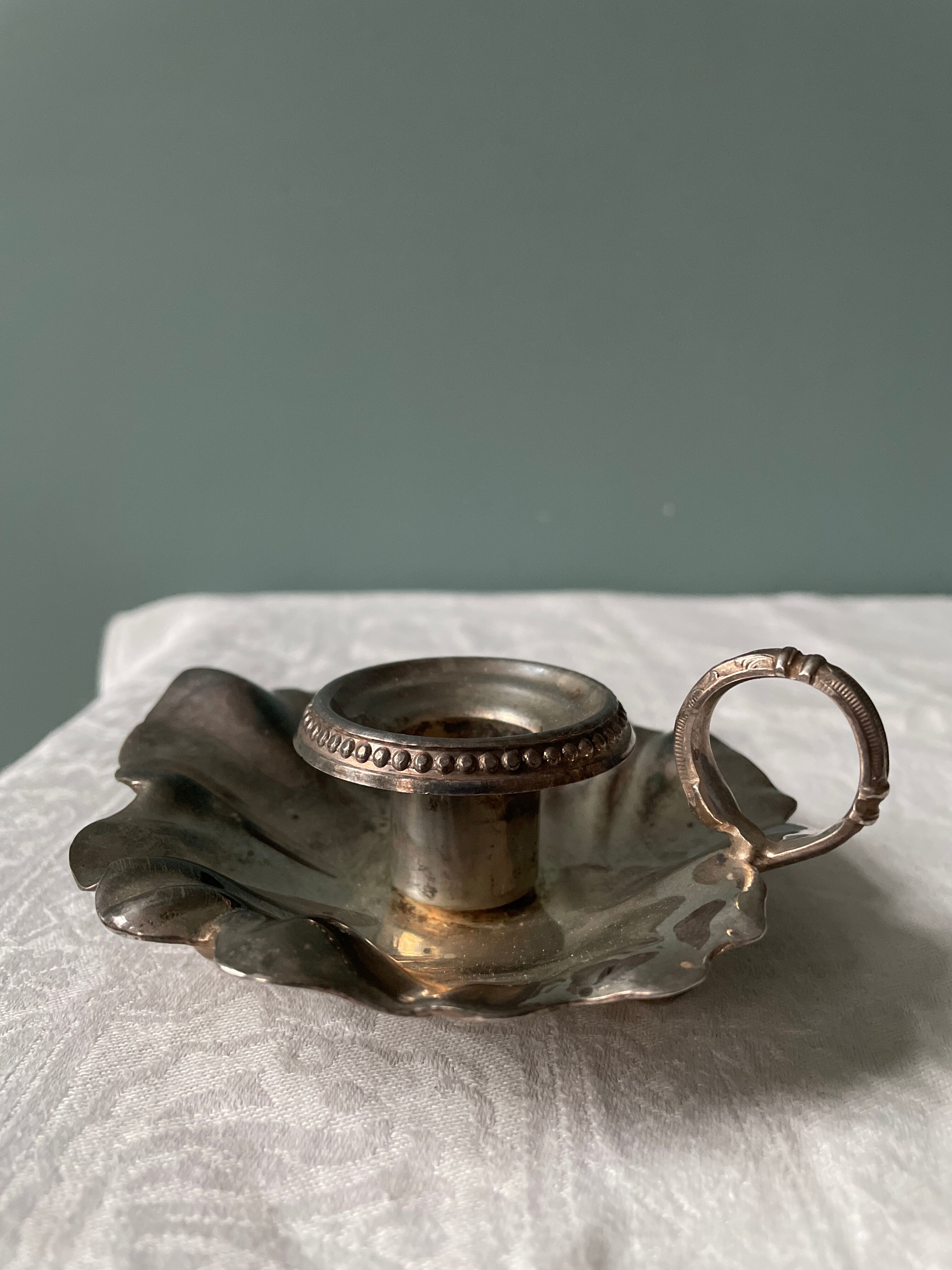 Old leaf-shaped hand candle holder, mid-twentieth