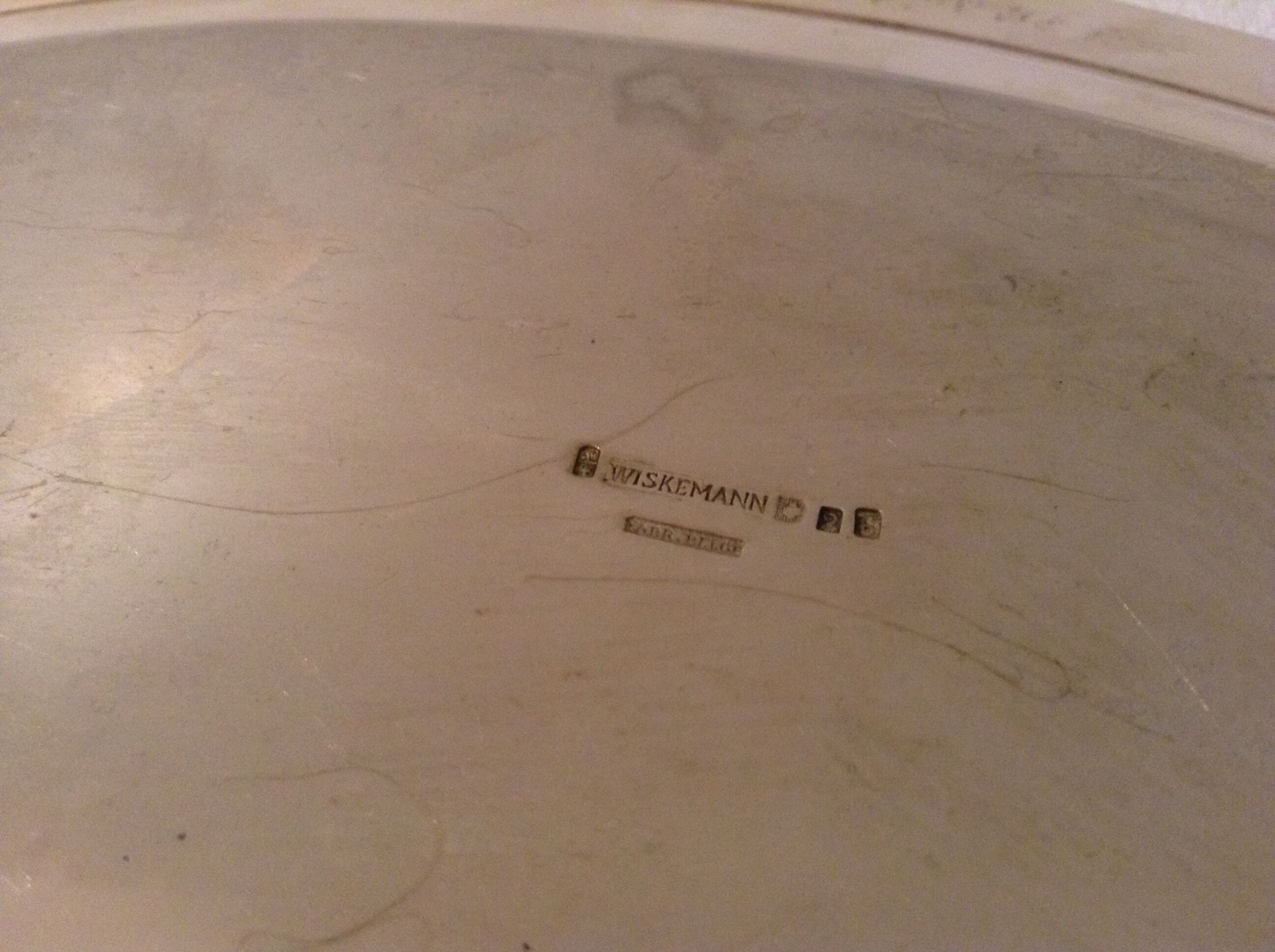 Flat oval silver metal