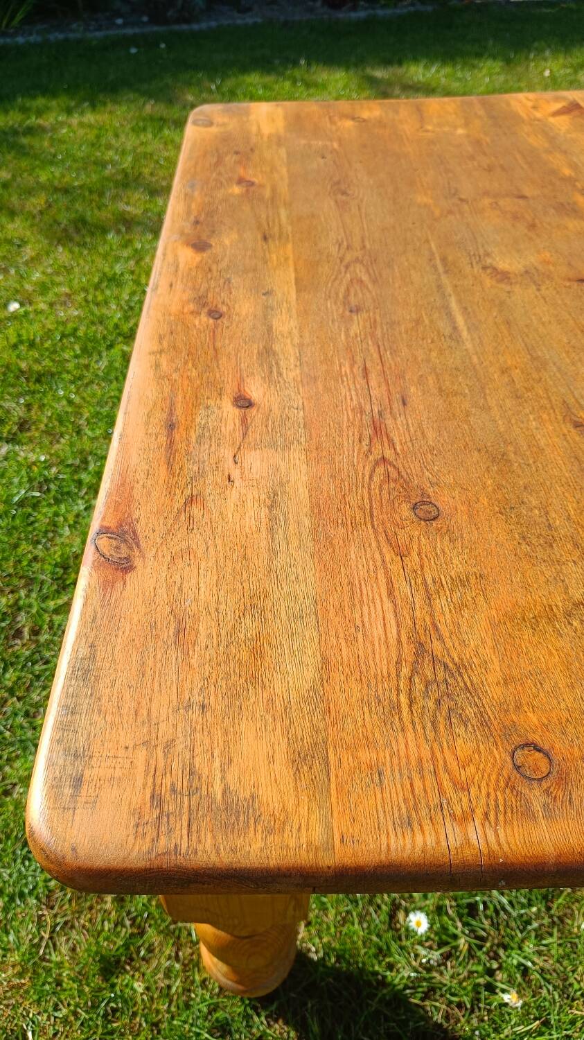 Solid oak coffee table with turned legs.