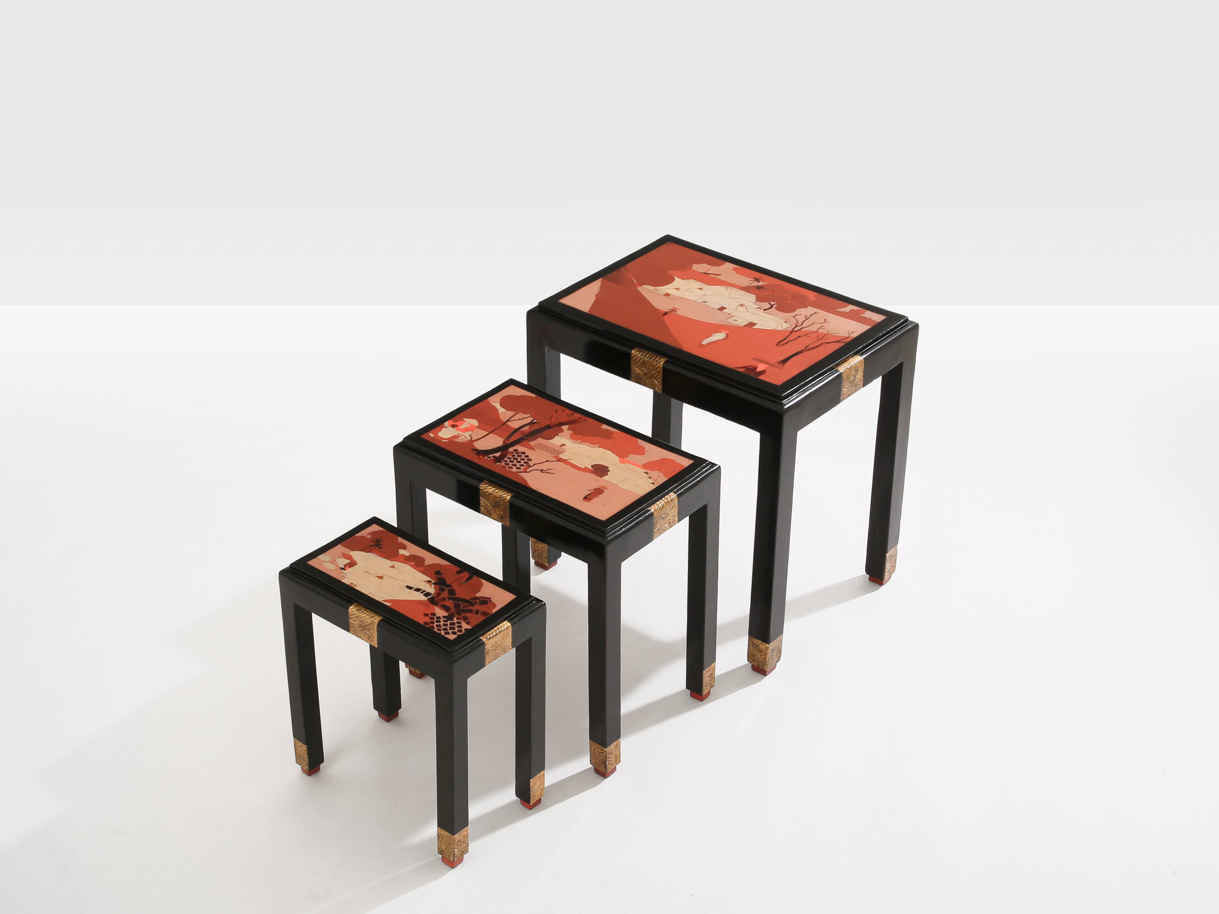 Set of three nesting tables with Asian decor, blackened wood, circa 1920.