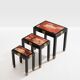 Set of three nesting tables with Asian decor, blackened wood, circa 1920.