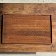Rectangular solid teak tray with carved edges 40x25