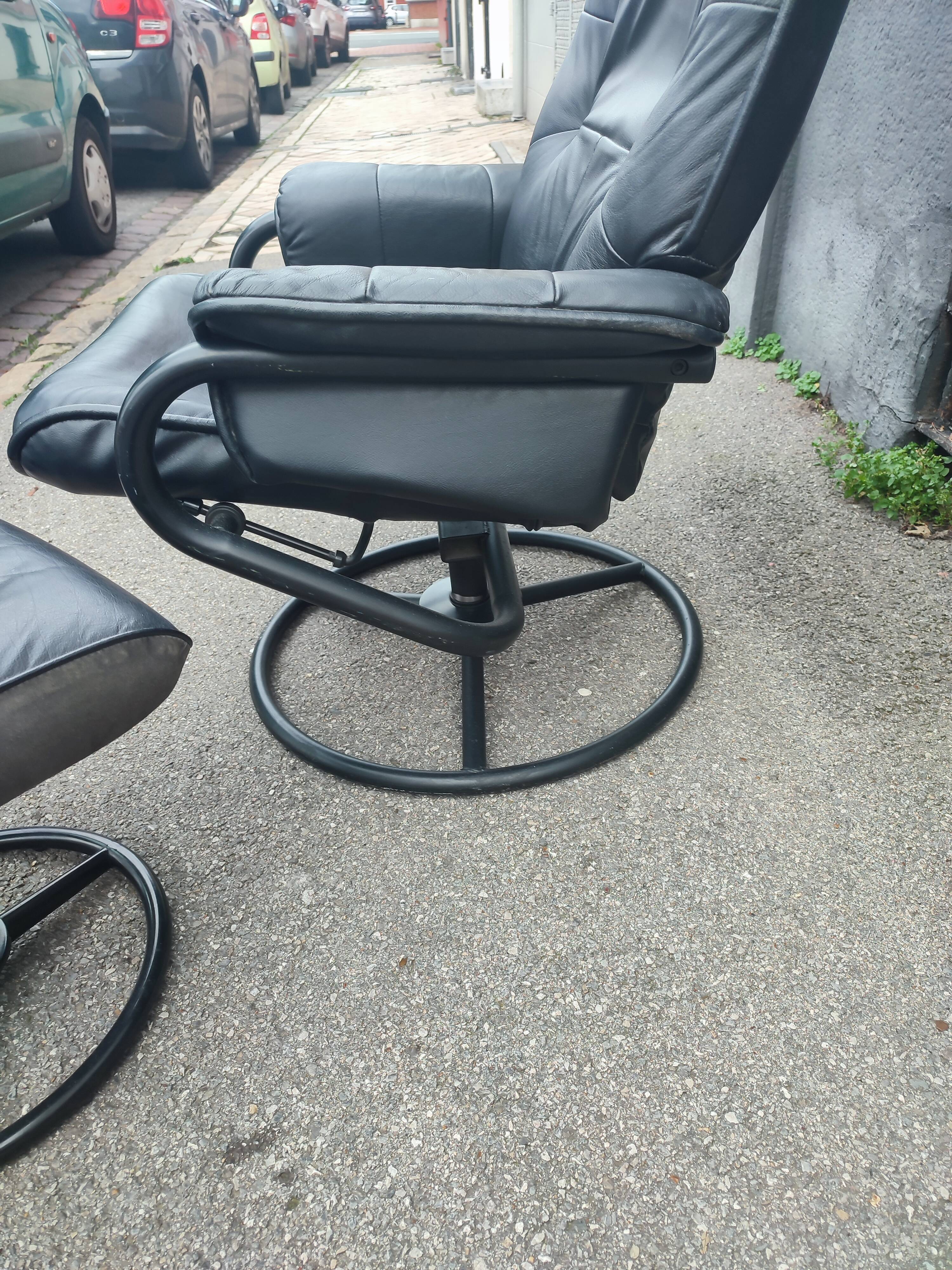 Scandinavian design leather armchair and footrest