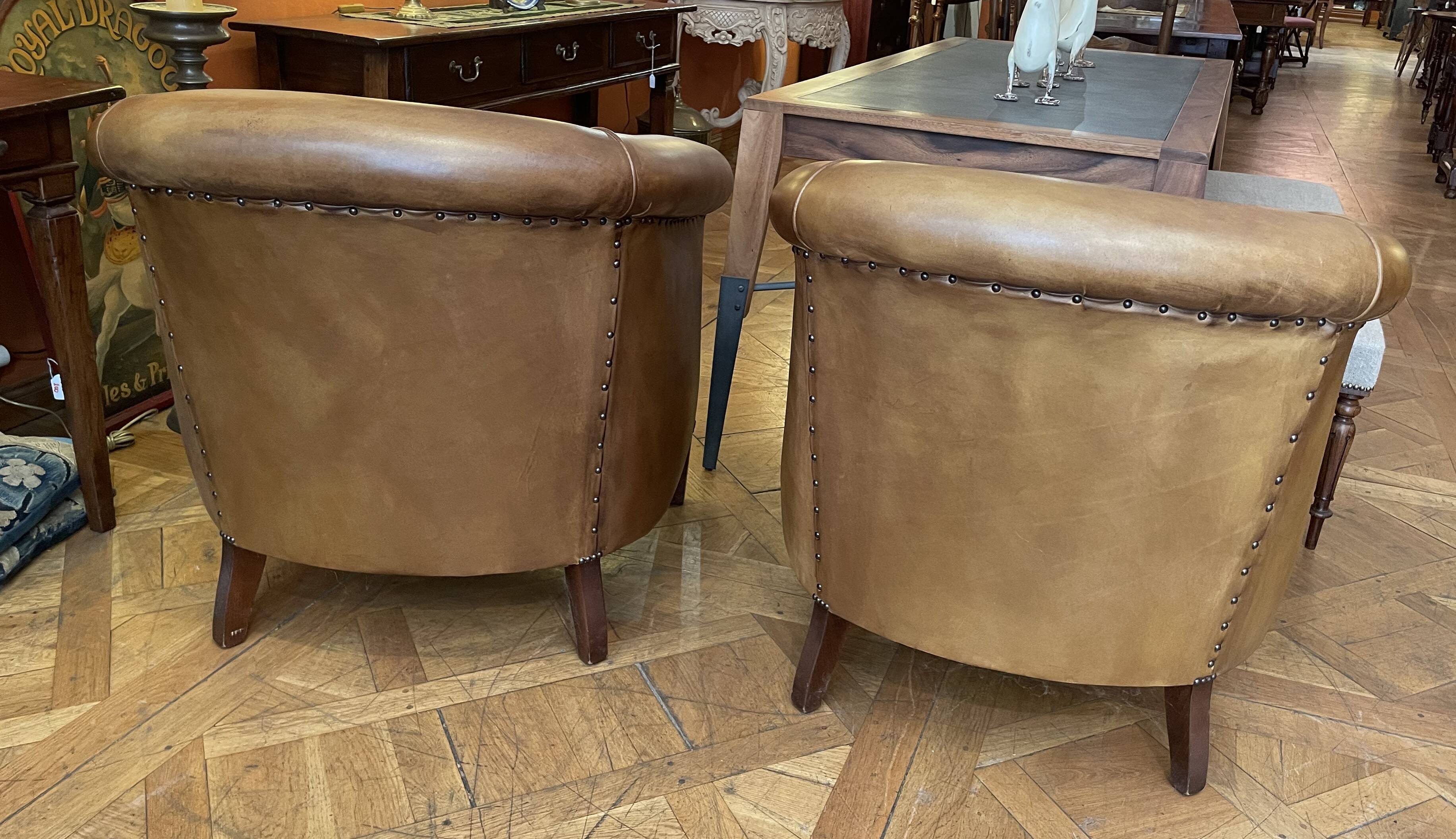 pair of camel leather club armchairs