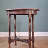 Candle holder side table with spool legs