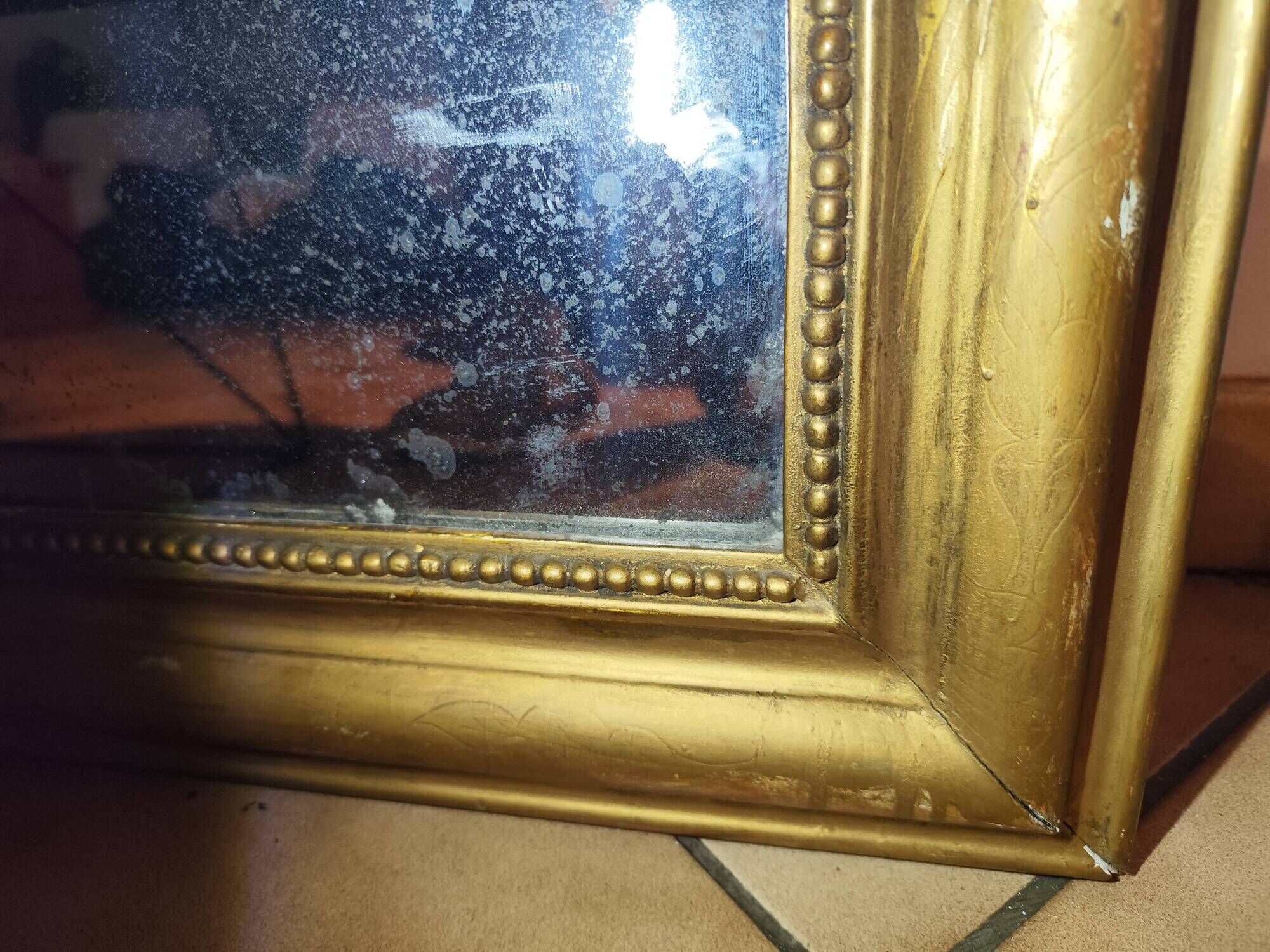 Antique Louis Philippe mirror, 19th century, mercury backing, wooden parquet back.