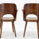 Pair of curved wooden shell armchairs in the style of Oswald Haerdtl.