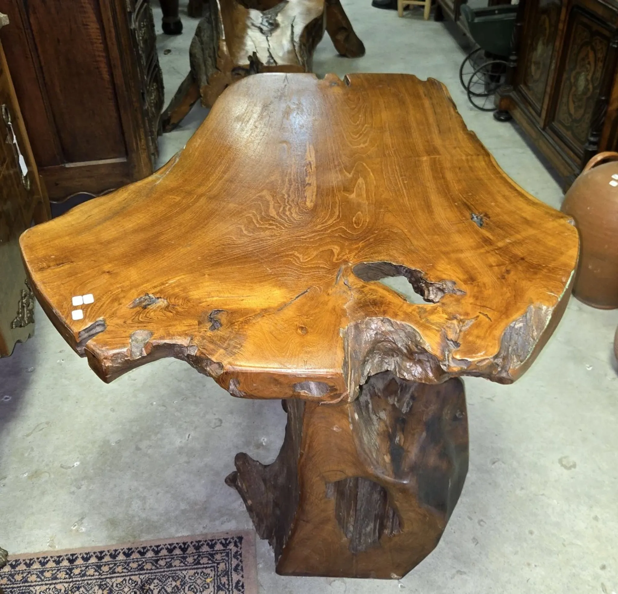 Sculpted olive wood table, made from a root.