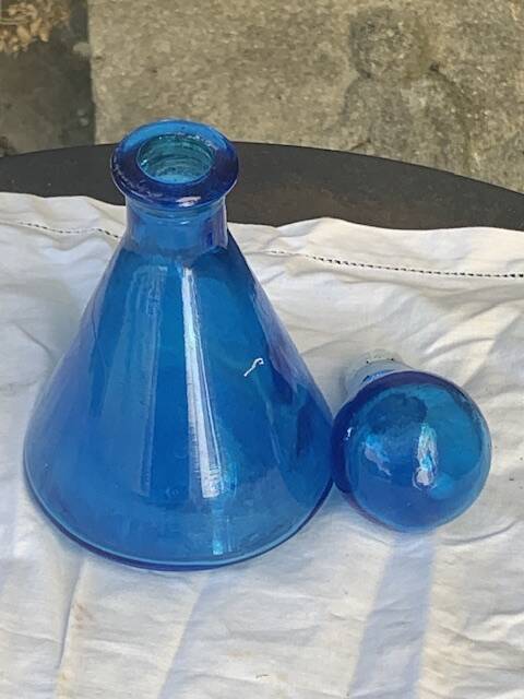 Blue bottle, glass vial for vintage perfume or liqueur.