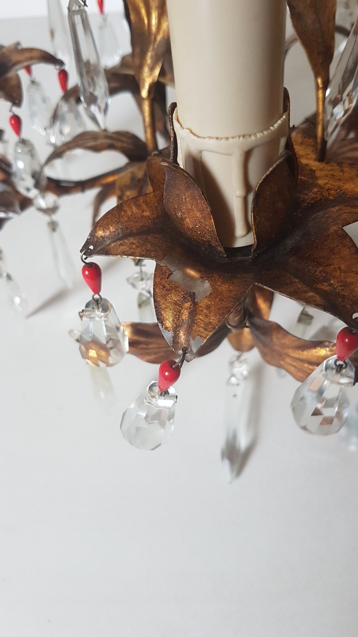 Gold metal chandelier and stamps