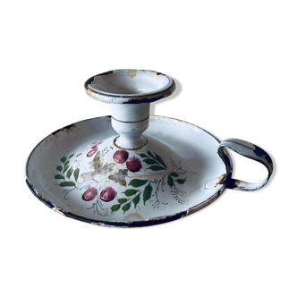 Old enamelled metal candlestick
