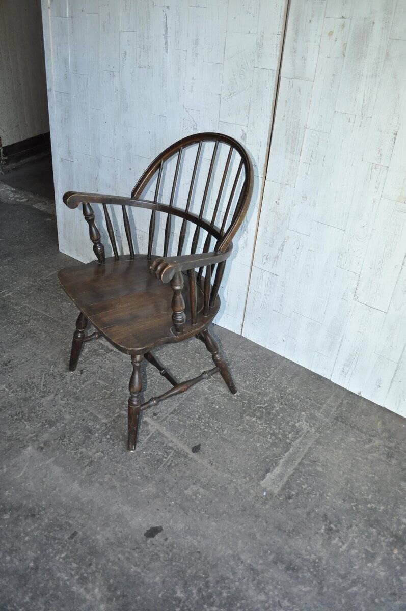 Brown wooden Windsor chair, 19th century — slatted backrest and carved seat
