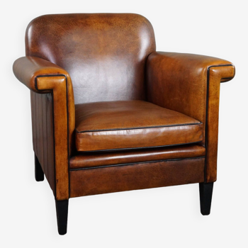 Sheepskin Art Deco design armchair with accents all around