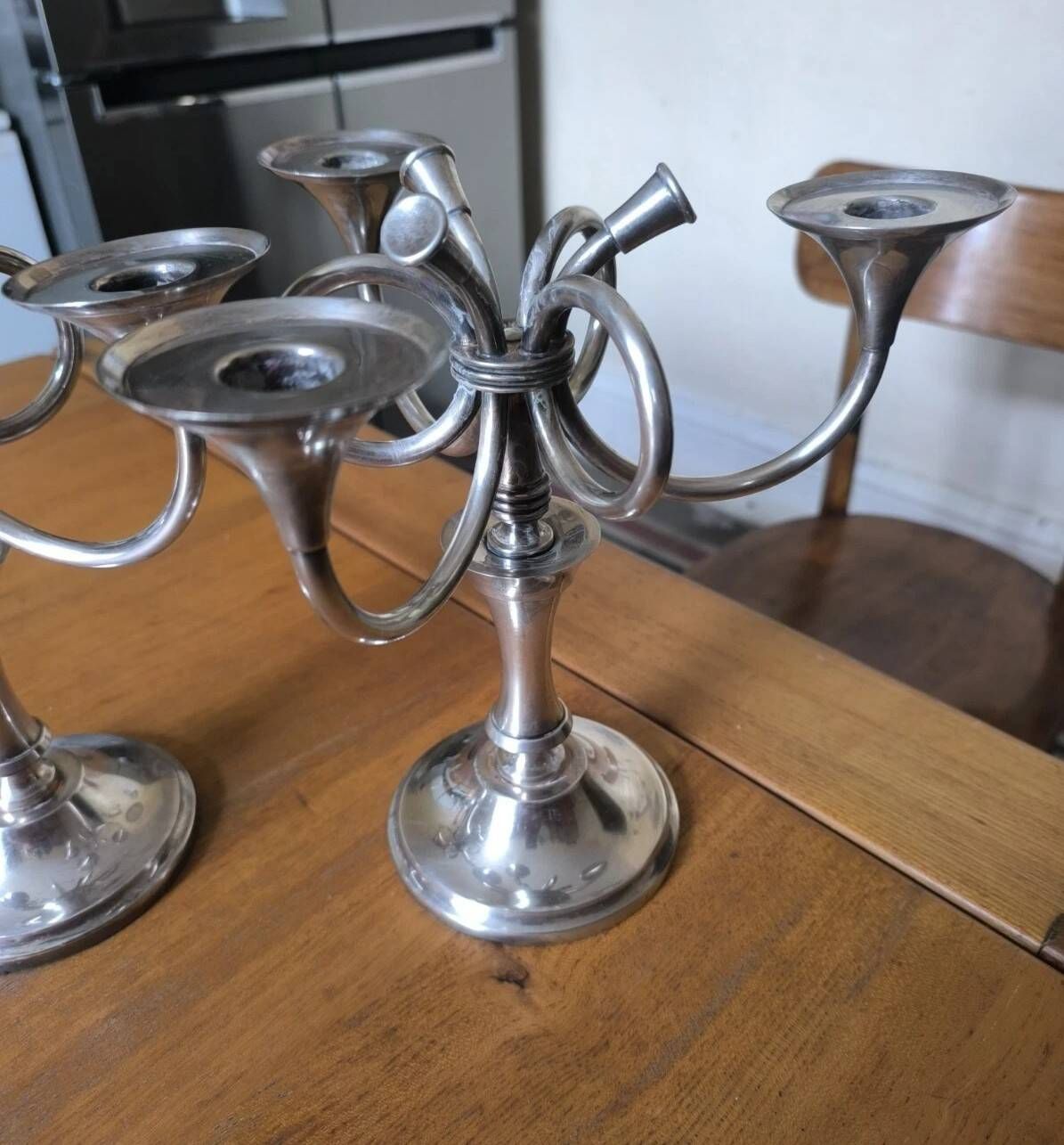 Ercuis pair of candlesticks model Cheverny in silver-plated metal with hunting horn decoration.
