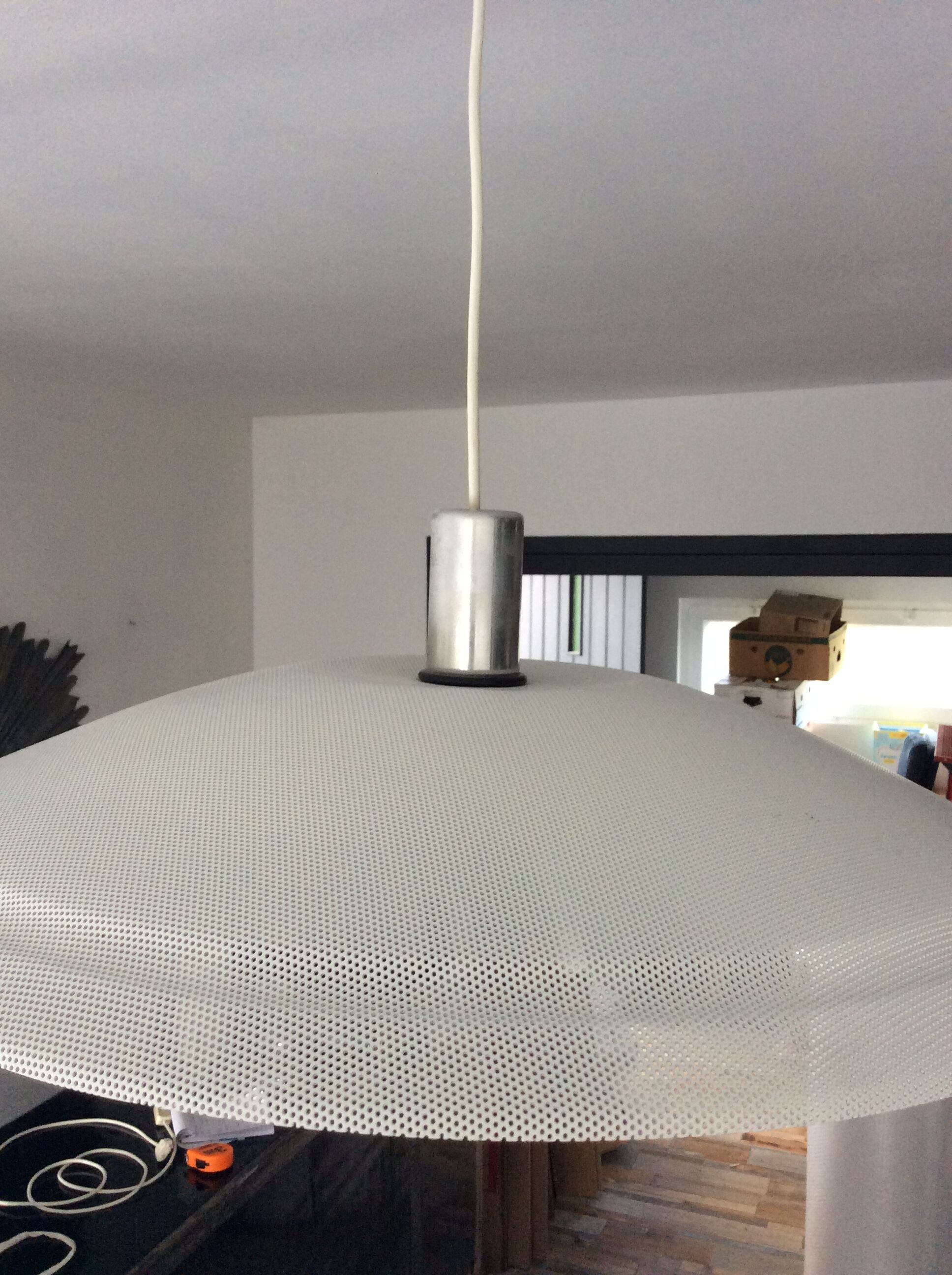 Suspension of the 70s in perforated metal