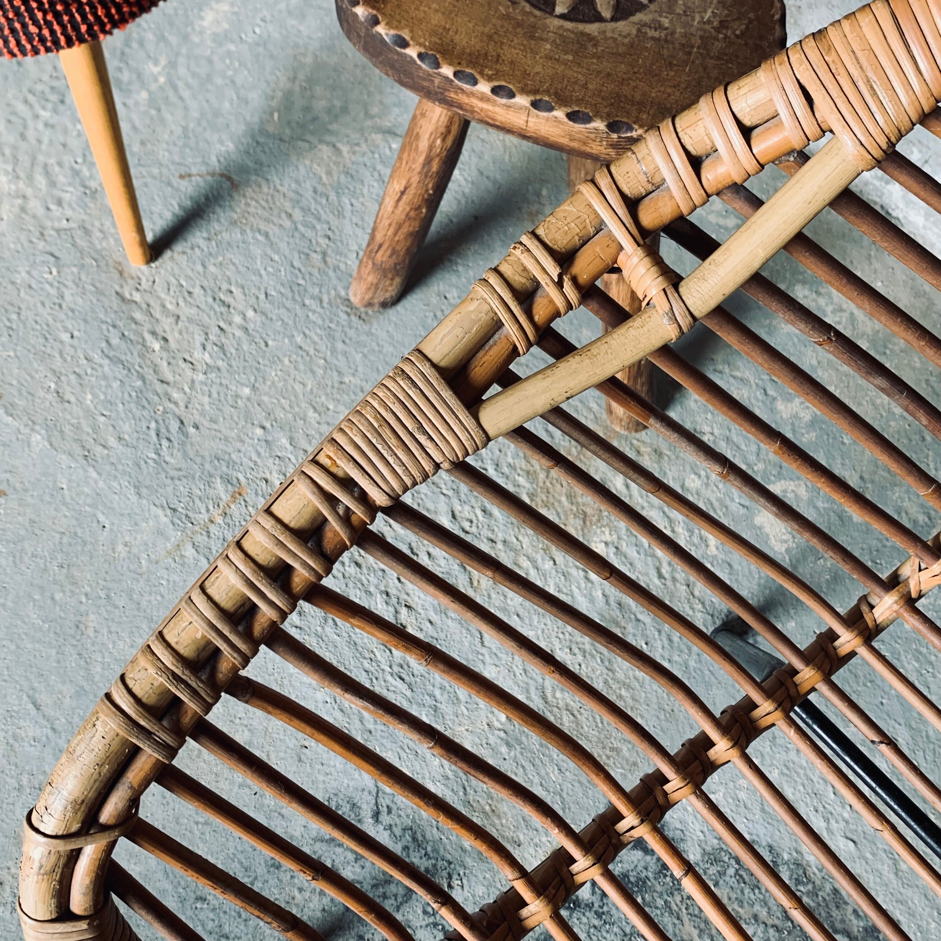 Rattan armchair and black metal base 1960
