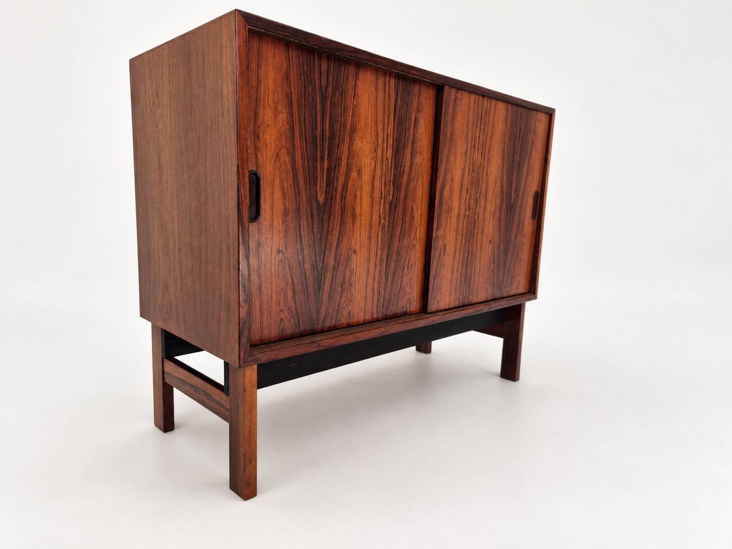 Low sideboard in rosewood with sliding doors. Denmark, 1960s