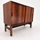 Low sideboard in rosewood with sliding doors. Denmark, 1960s