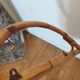 Vintage half-moon rattan shelf