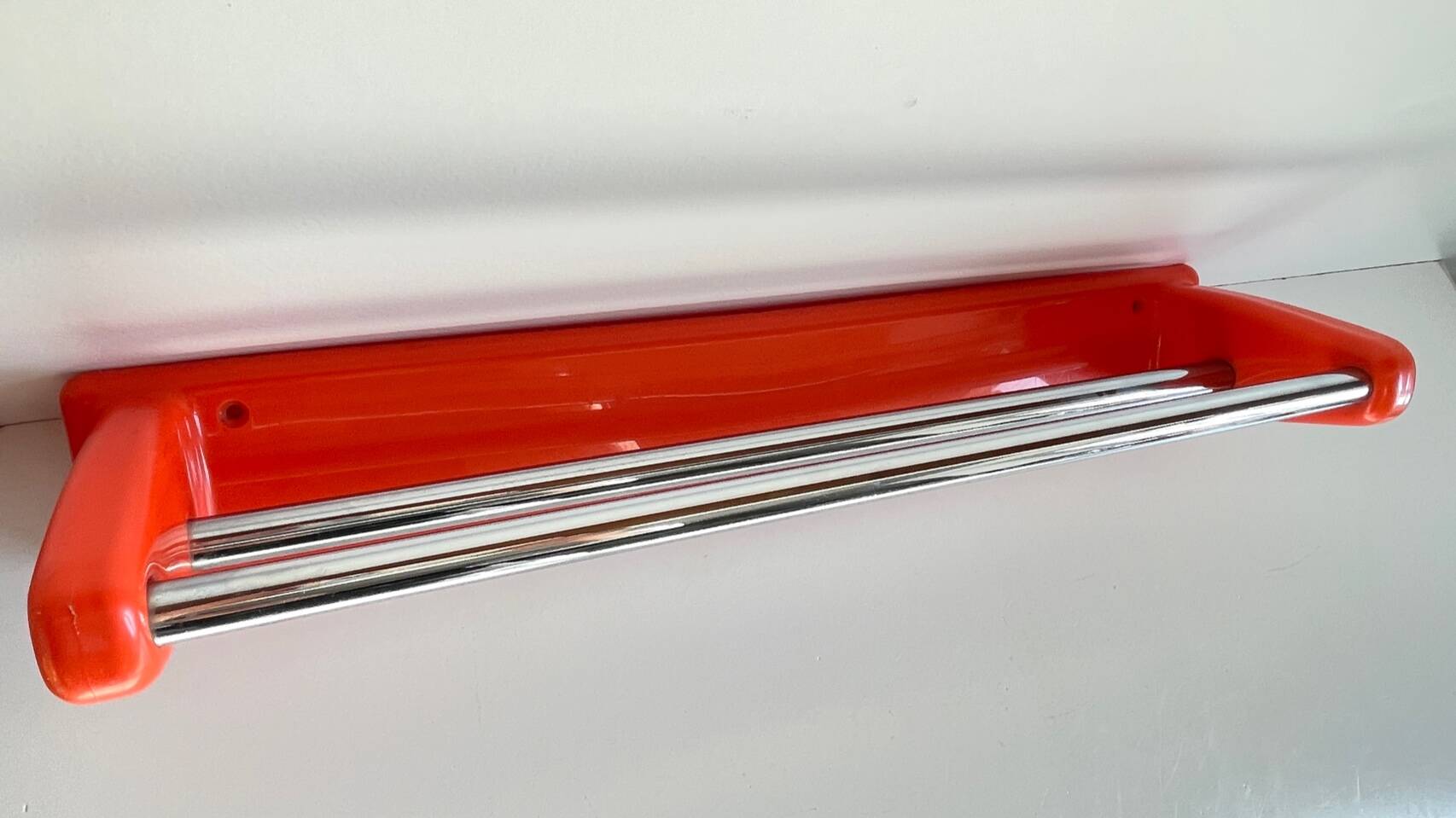 Orange towel rack by Syla from the 70s