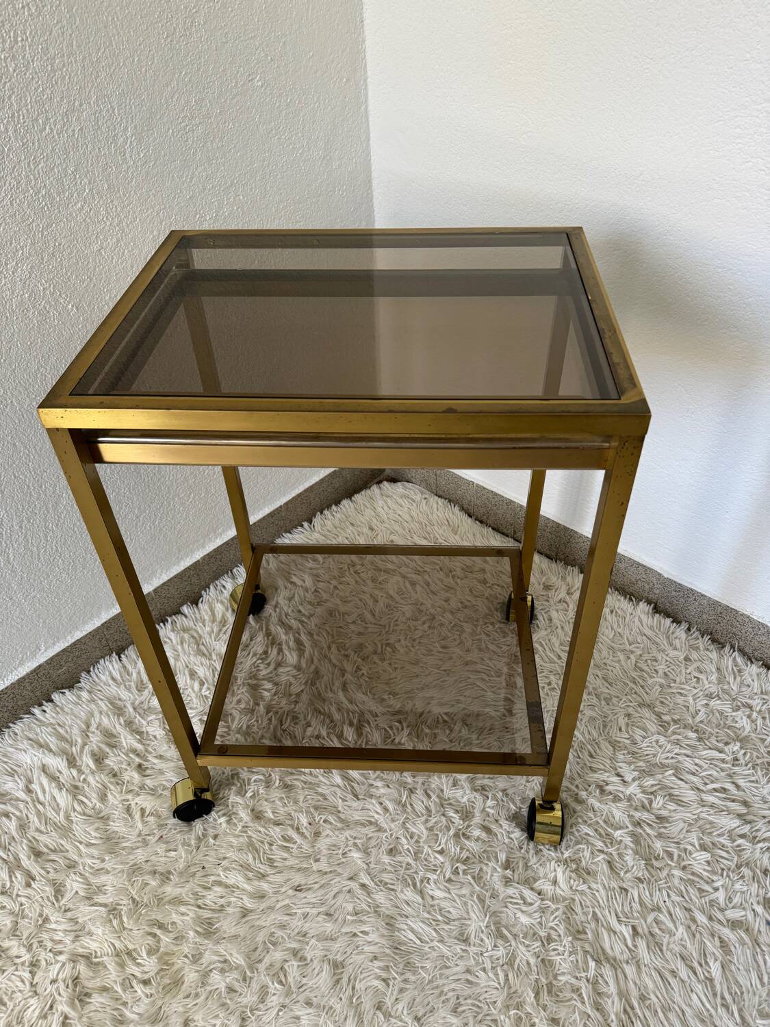 Brass rolling trolley with smoked glass from the 70s
