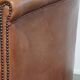 English club chair in light cognac cowhide leather.