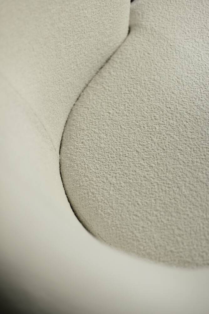 Low oak armchair with modern mid-century Scandinavian fabric and rounded backrest, 1960s.