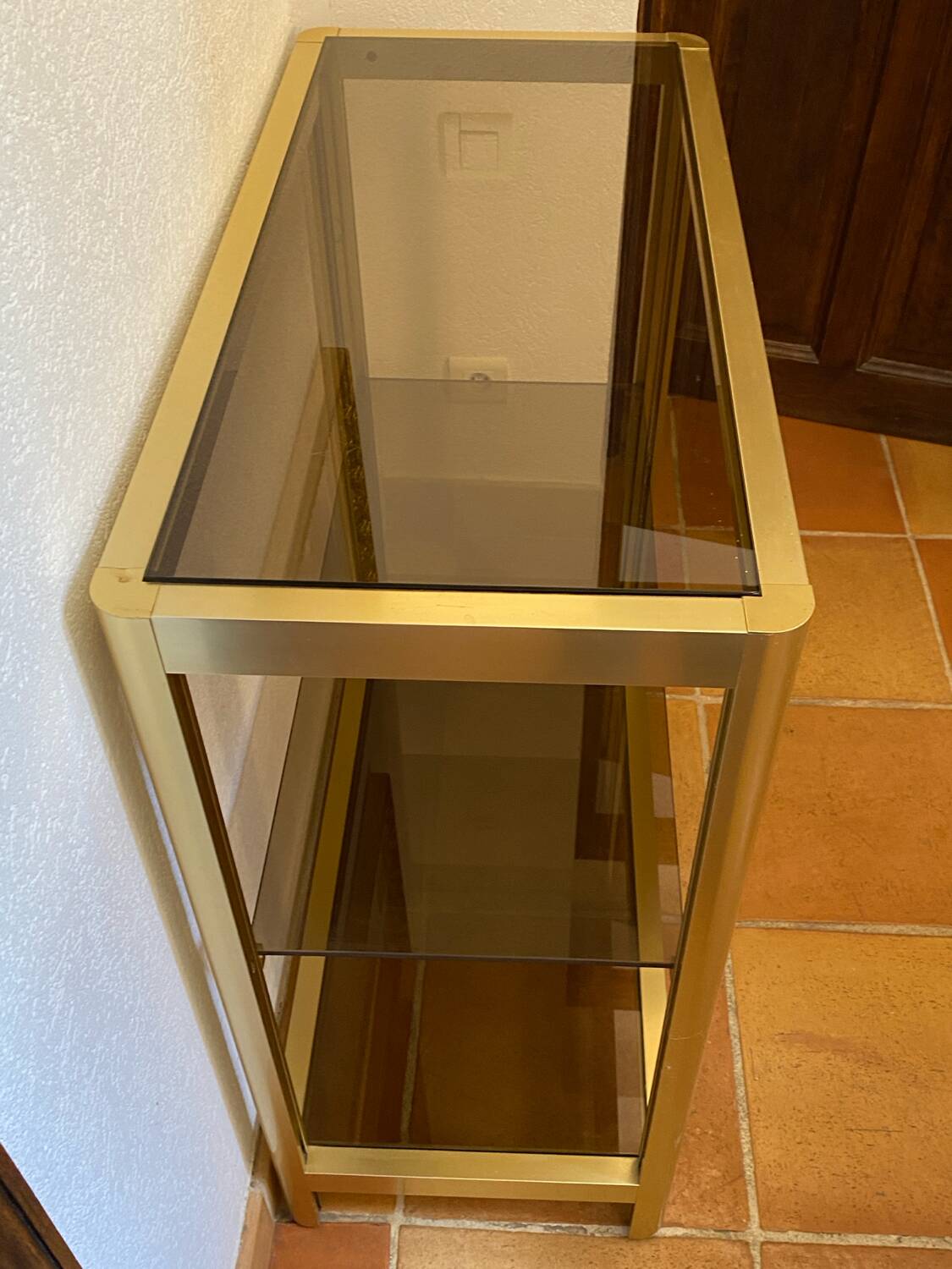 Regency style console table, in gilded metal and smoked glass