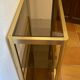 Regency style console table, in gilded metal and smoked glass