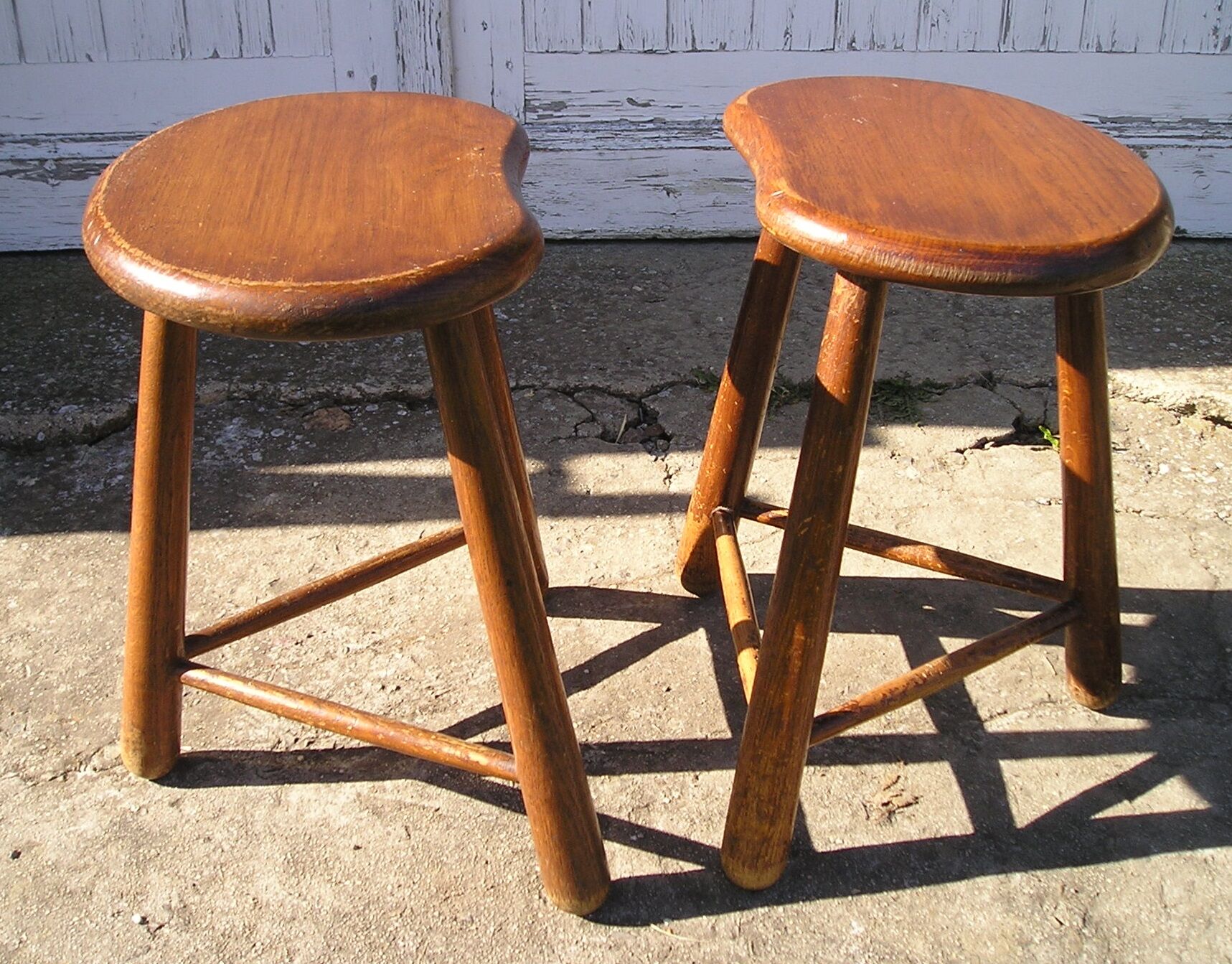 Pair of 70s wooden tripod stools