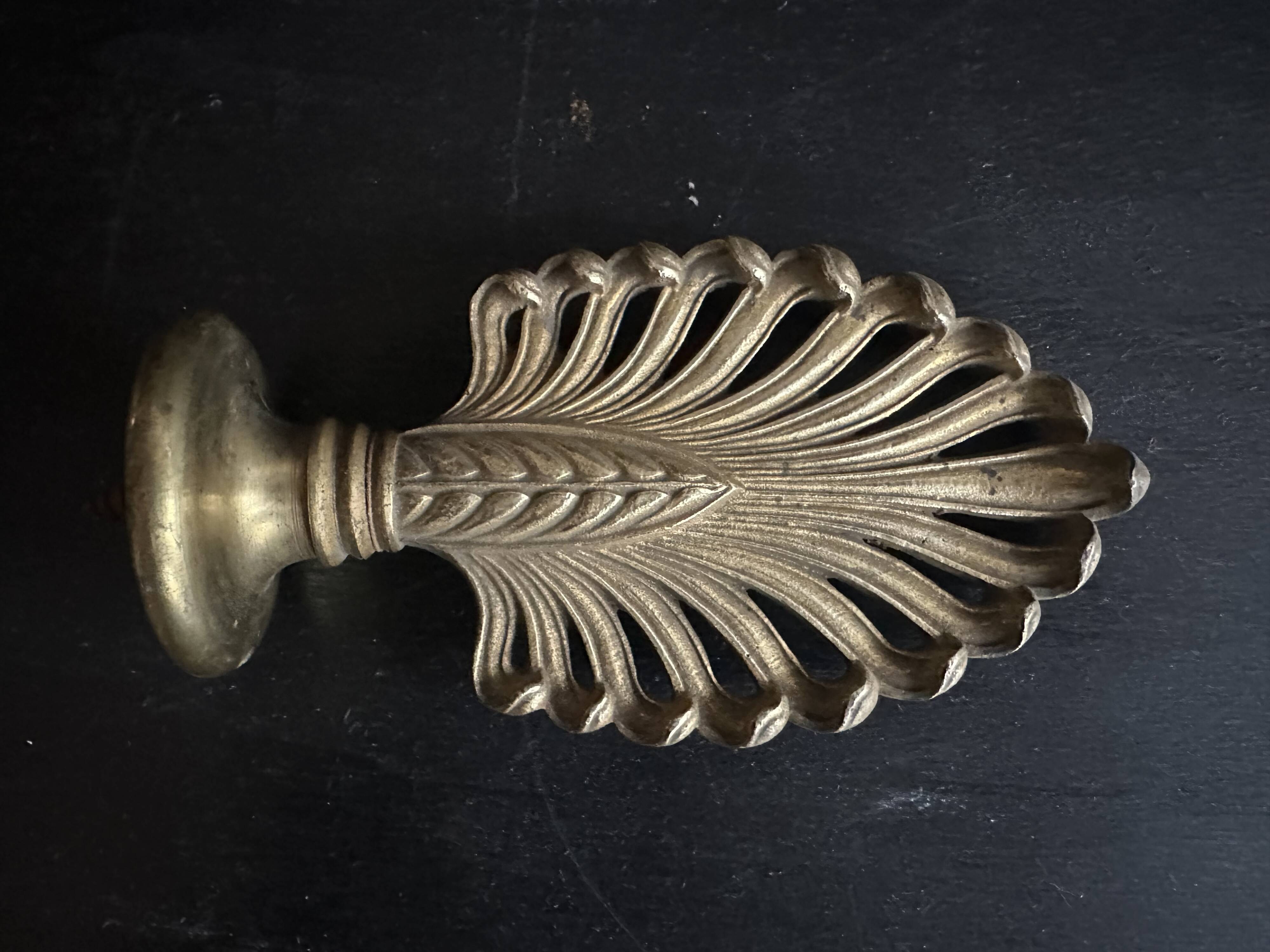 Pair of bronze curtain rod finials in the Napoléon III style with a palmette design.