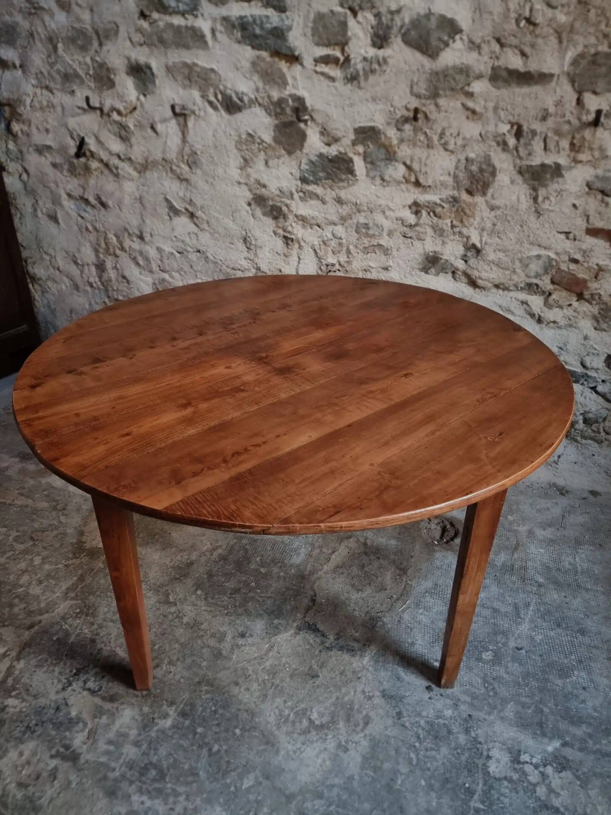 Antique round dining table in cherry wood, France, circa 1920.