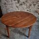 Antique round dining table in cherry wood, France, circa 1920.