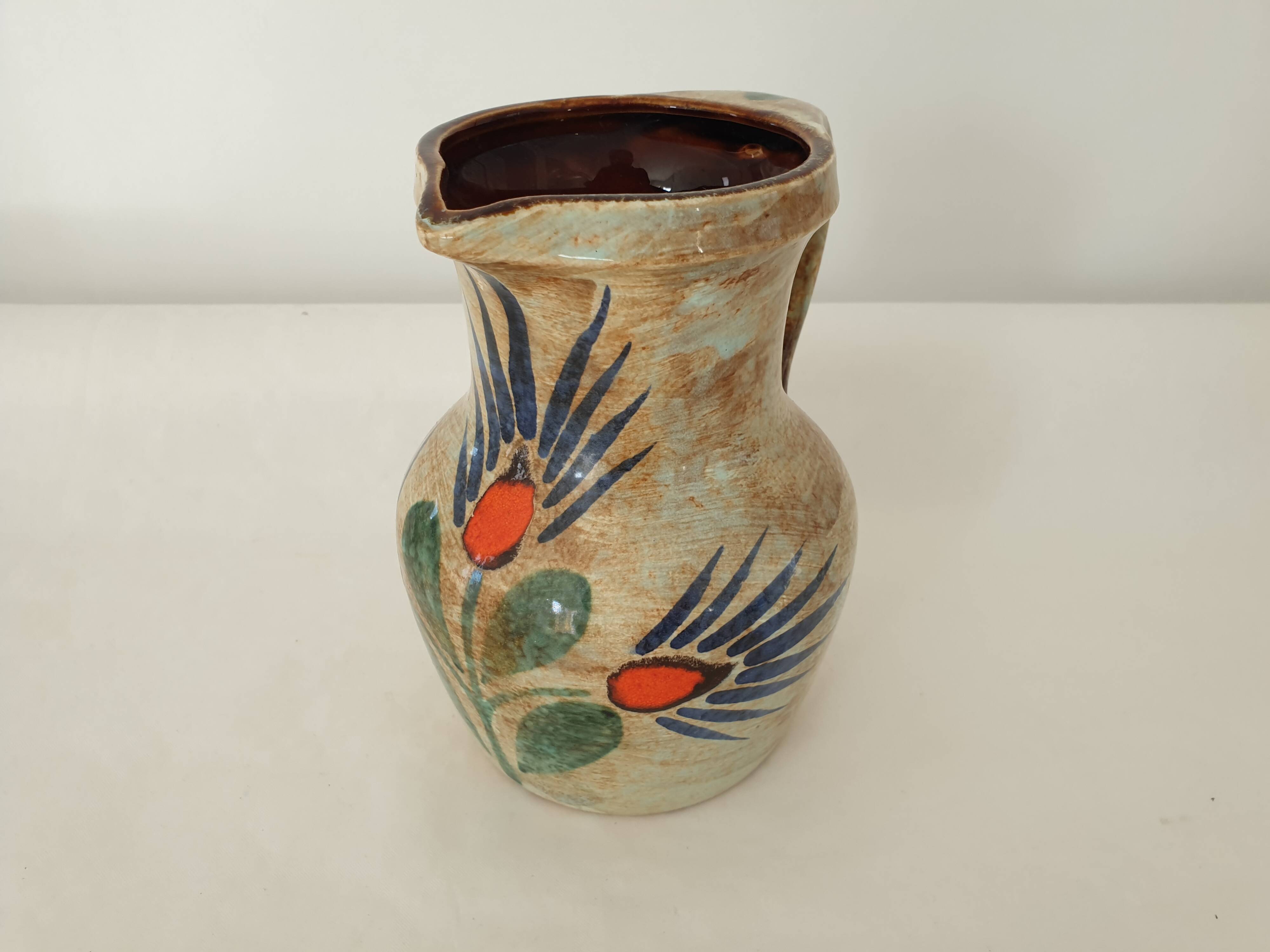 Ceramic pitcher with floral motif signed Saint Clément