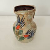 Ceramic pitcher with floral motif signed Saint Clément