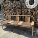 Baumann bench with wooden frame and faux leather seat.