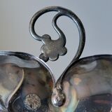 Old empty cut pocket in silver metal art nouveau in the shape of a sheet