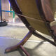 Rocking lounge chair made of fabric suitable for outdoor use.