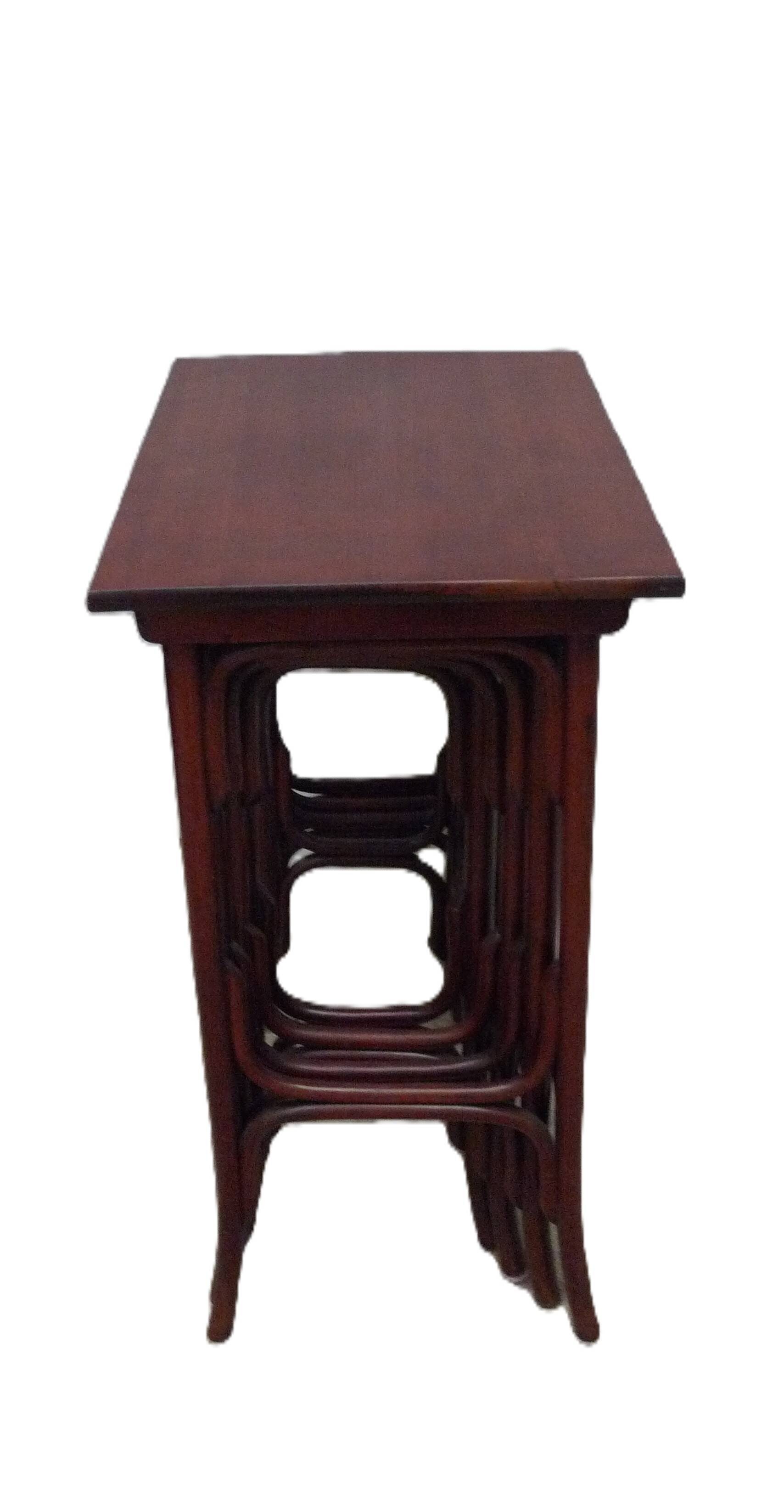 Four Thonet nesting tables.