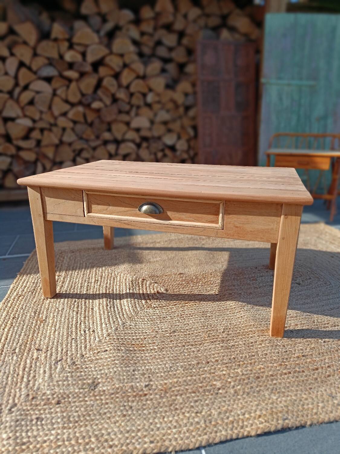 Low farmhouse table in raw wood