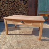 Low farmhouse table in raw wood