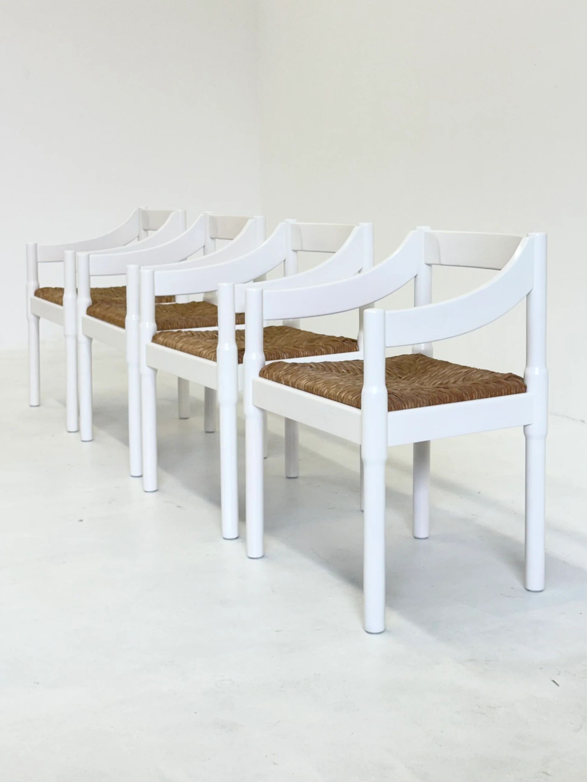 Set of two Carimate chairs by Vico Magistretti in white